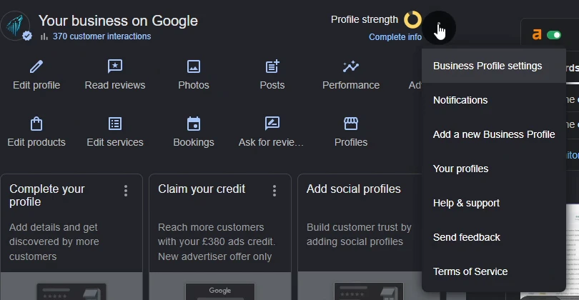 The Your business on Google panel with the three-dot menu open and Business Profile settings highlighted